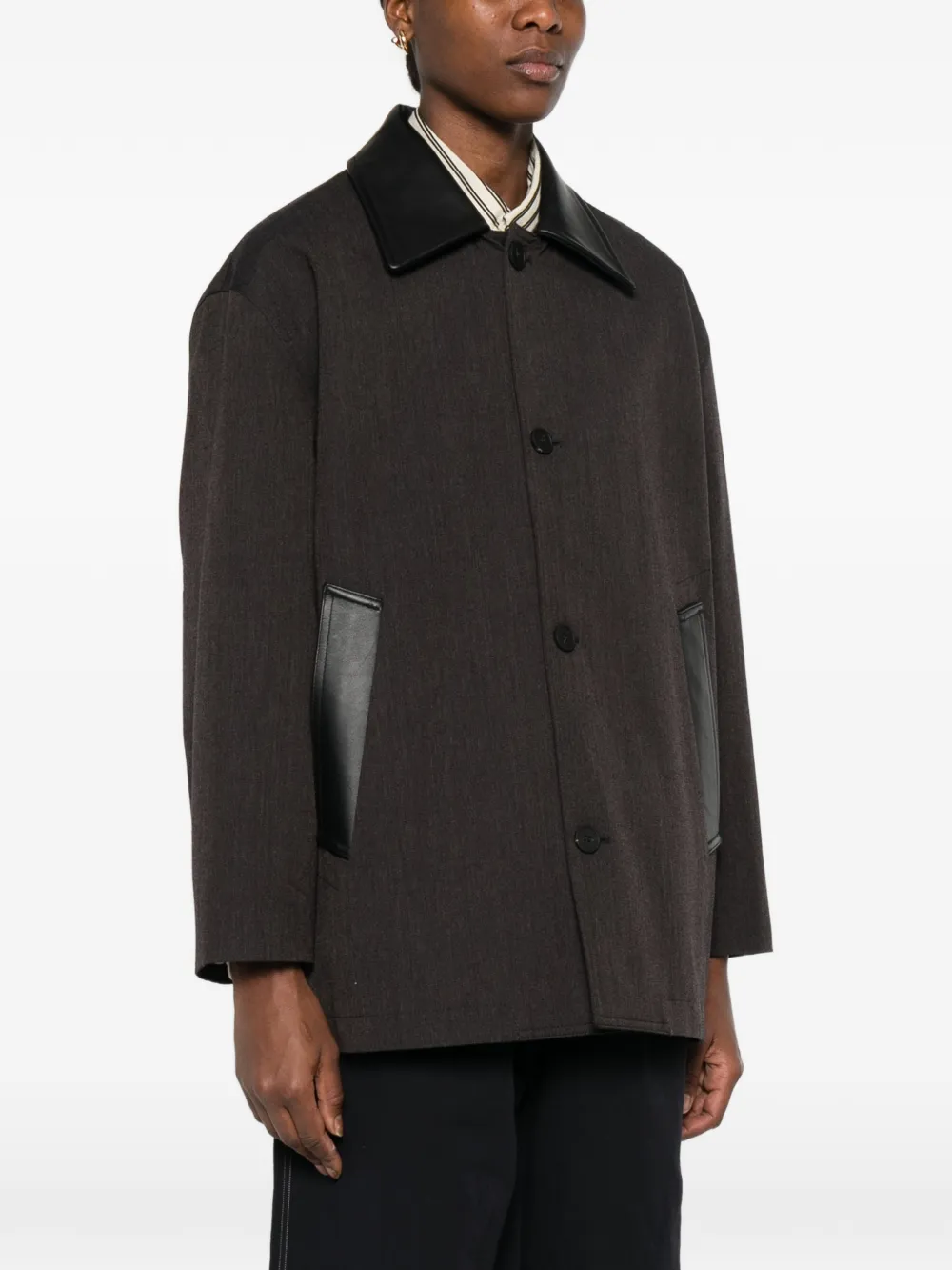 brown jackets-coats worn by a person, showing the  jackets-coats fit