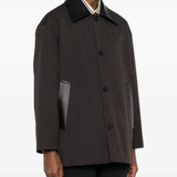 brown jackets-coats worn by a person, showing the  jackets-coats fit