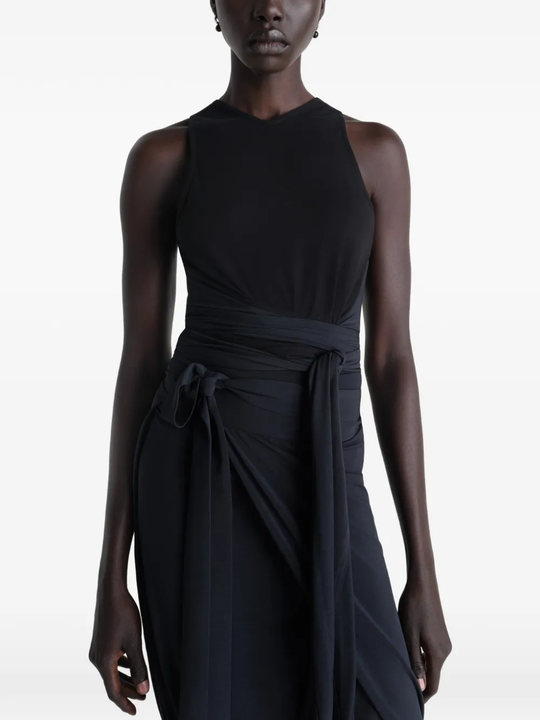 Black top worn by a person, showing the tops fit