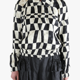 Black jacket worn by a person, showing the jacket's fit