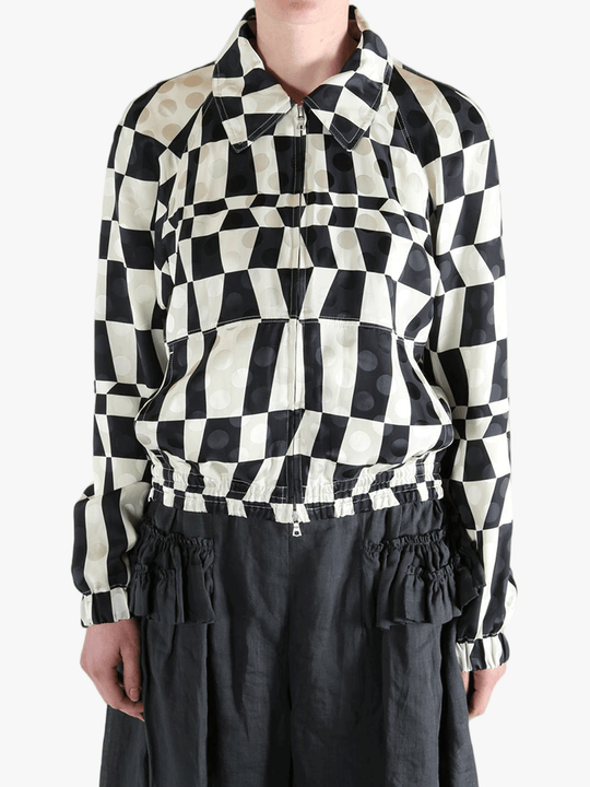 Black jacket worn by a person, showing the jacket's fit