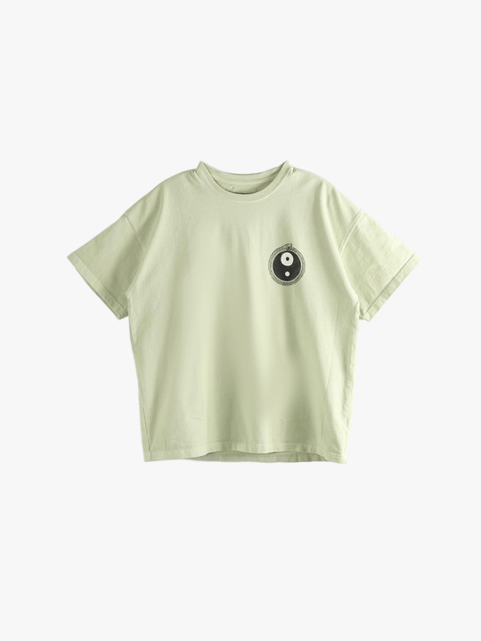 Green t-shirt worn by a person, showing the t-shirt's fit