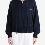 Navy hoodie worn by a person, showing the hoodie fit
