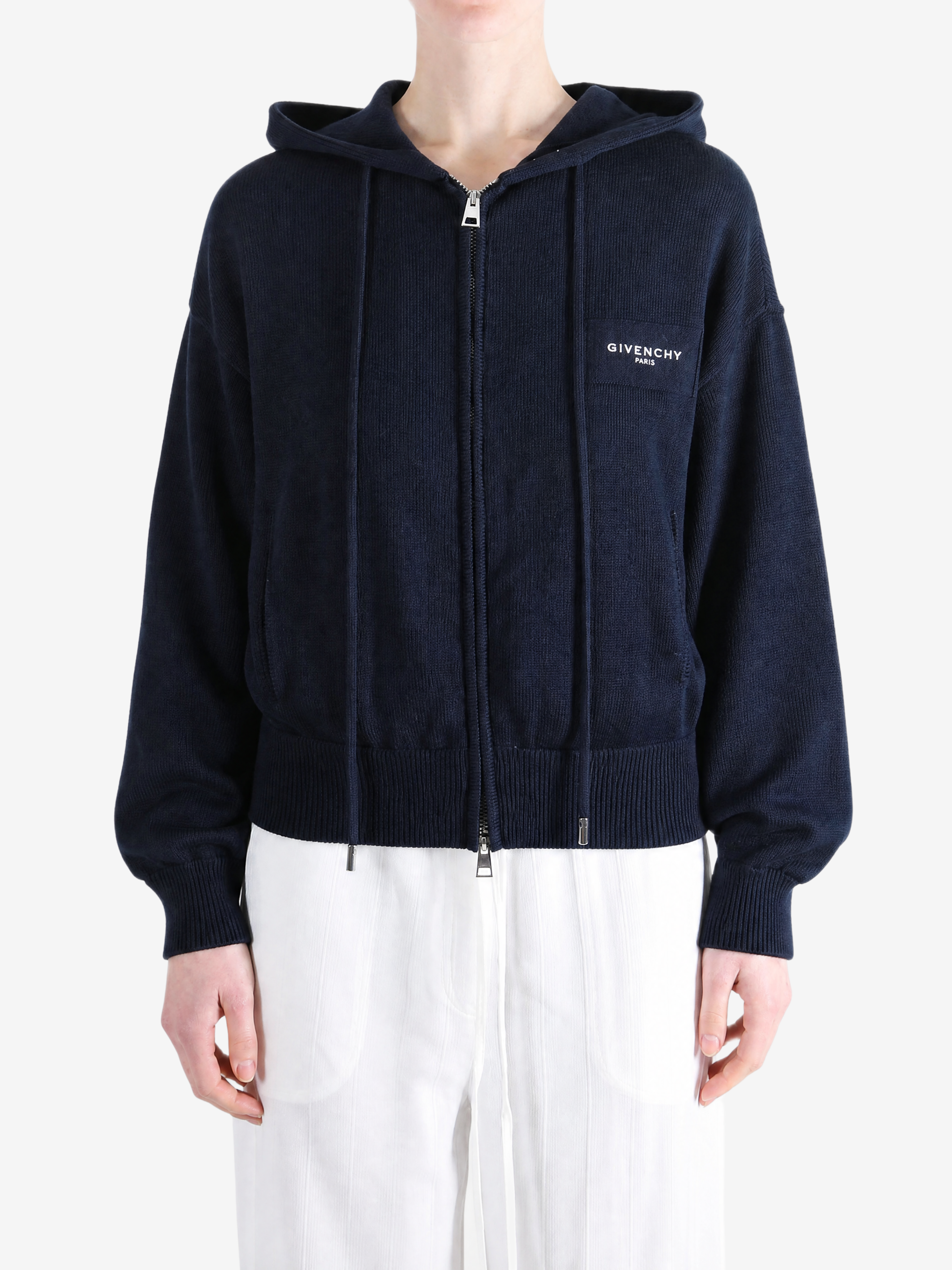 Navy hoodie worn by a person, showing the hoodie fit