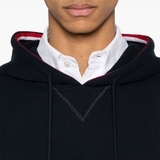 Close up of navy hoodies, showing texture of the cotton fabric