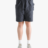 Gray shorts worn by a person, showing the short fit