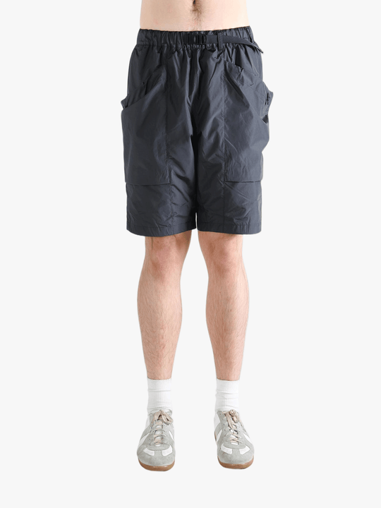Gray shorts worn by a person, showing the short fit