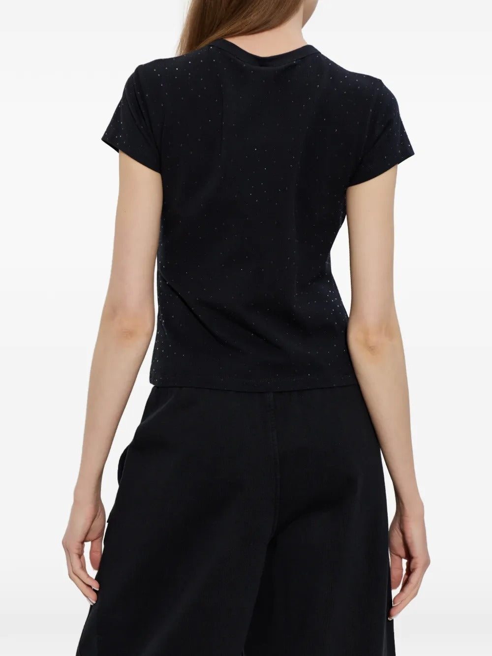 Black t-shirt worn by a person, showing the t-shirt's fit