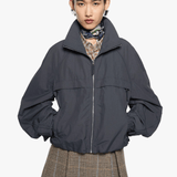 Grey jacket worn by a person, showing the jacket fit