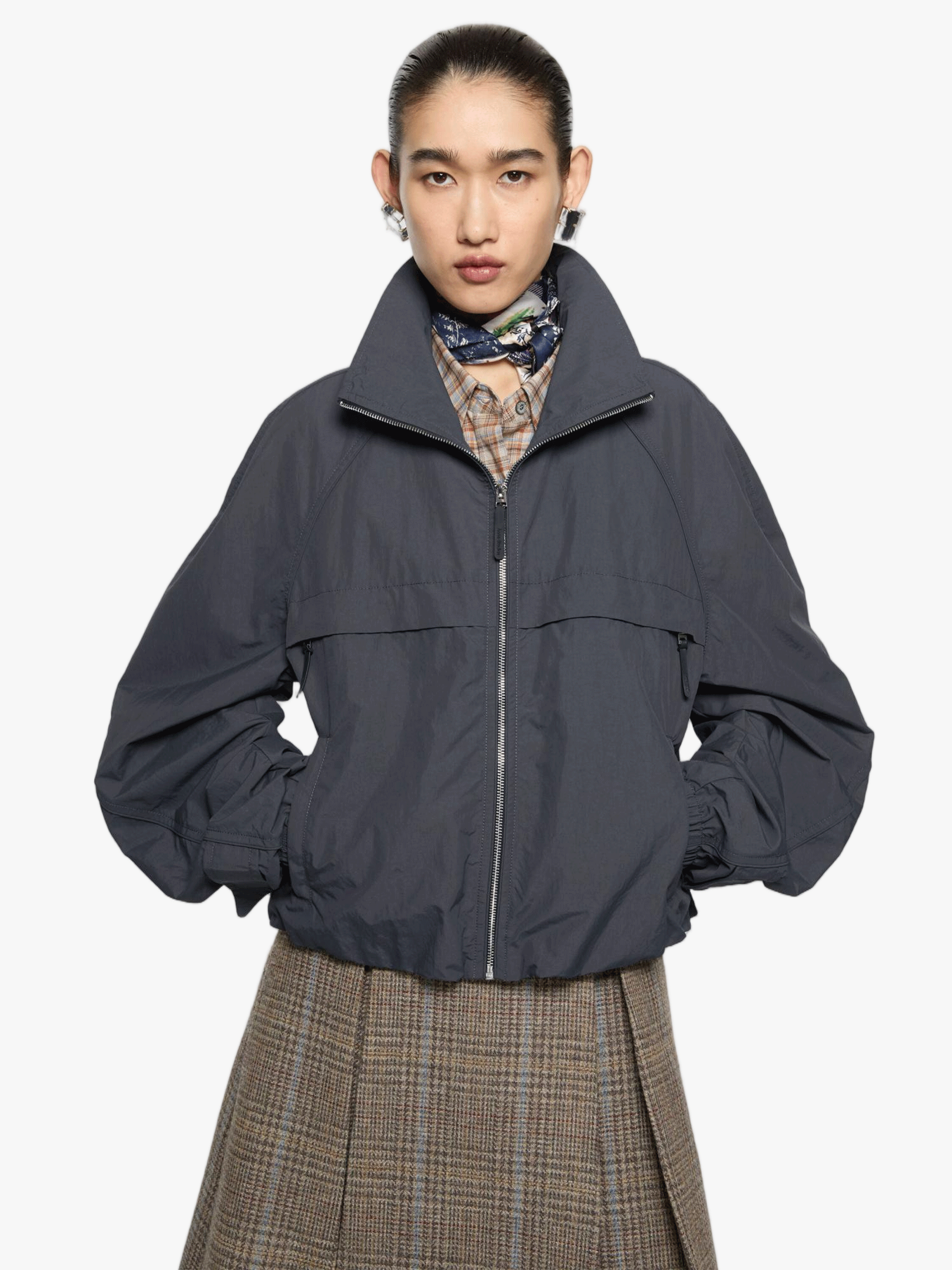 Grey jacket worn by a person, showing the jacket fit
