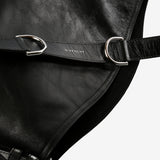 Close up of black bag, showing texture of the leather fabric