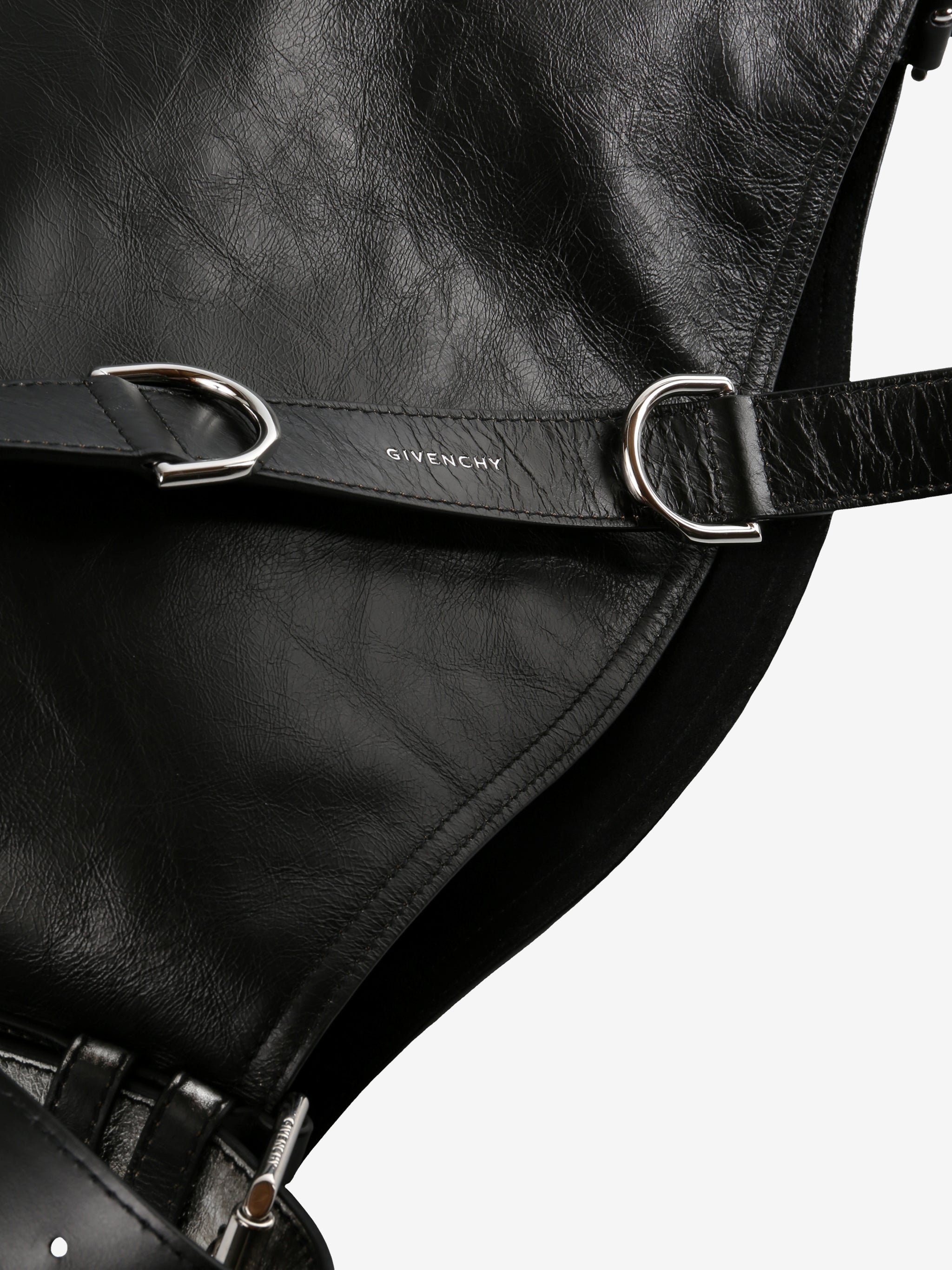 Close up of black bag, showing texture of the leather fabric