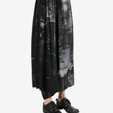 Black pants worn by a person, showing the pants's fit