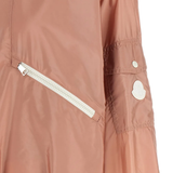 Close up of Pink jacket, showing the white logo-patch on shoulder