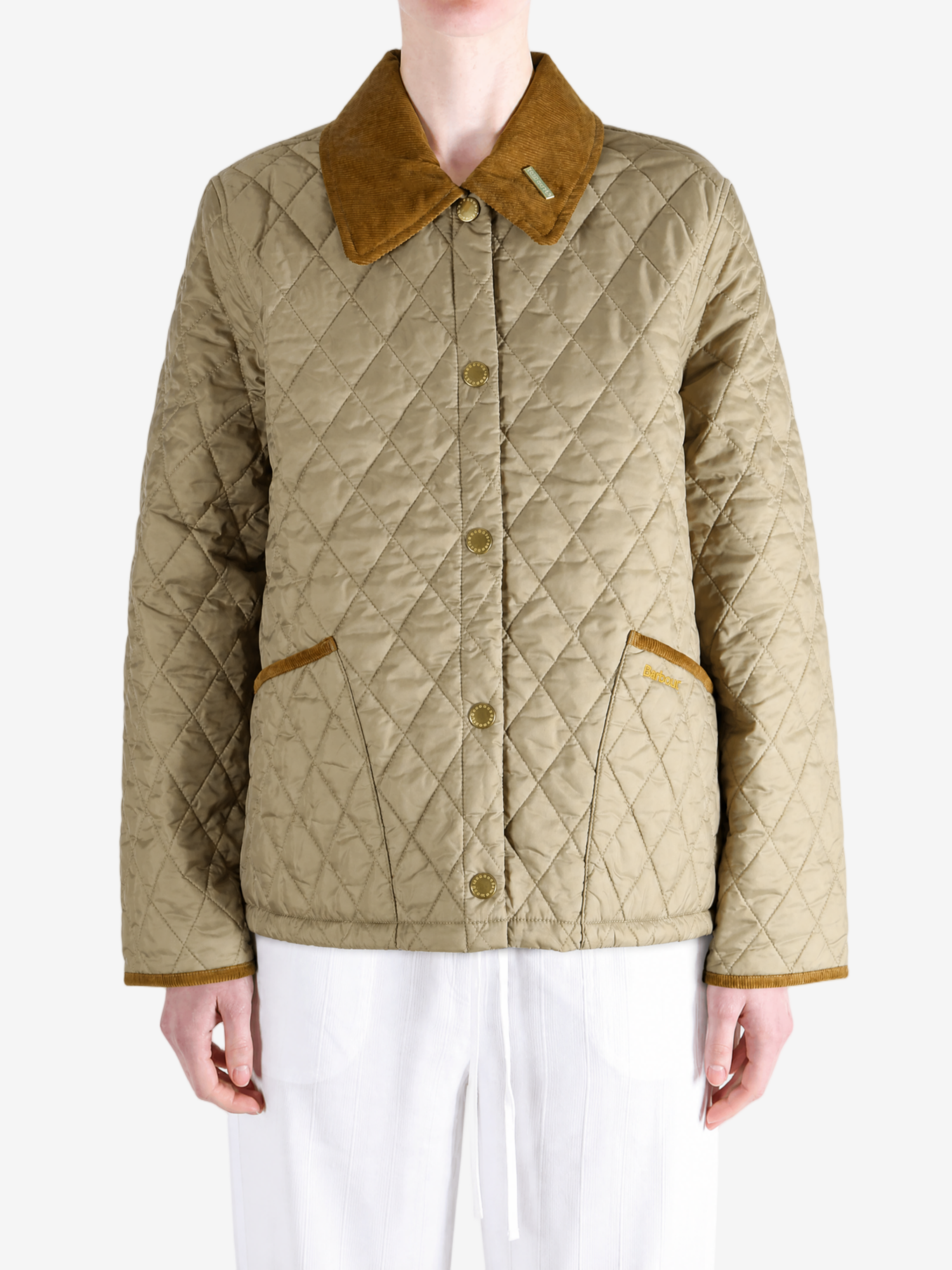 Tan jacket worn by a person, showing the jacket fit
