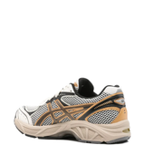 Tan sneakers, side view