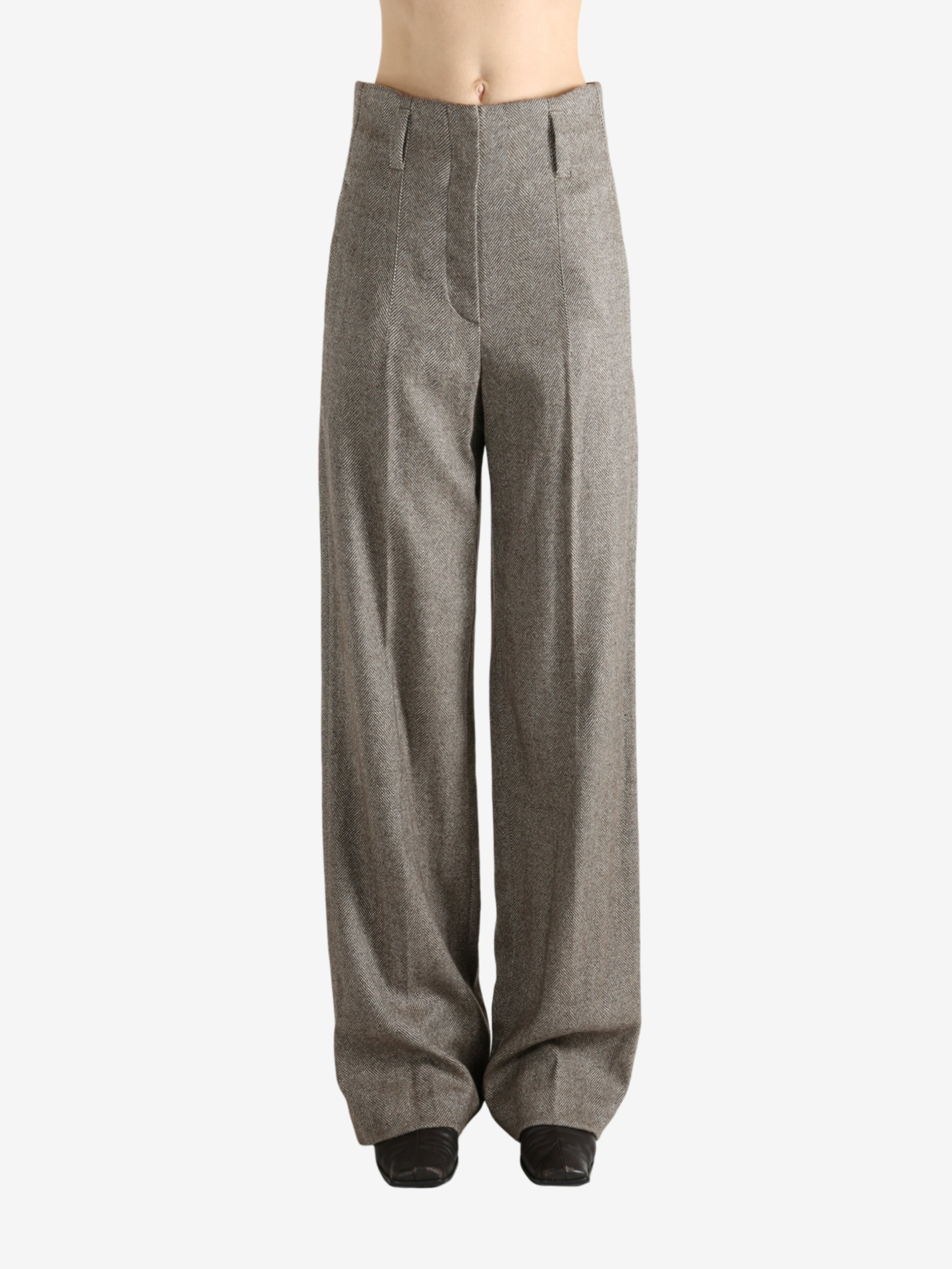 Brown pants worn by a person, showing the pant's ift