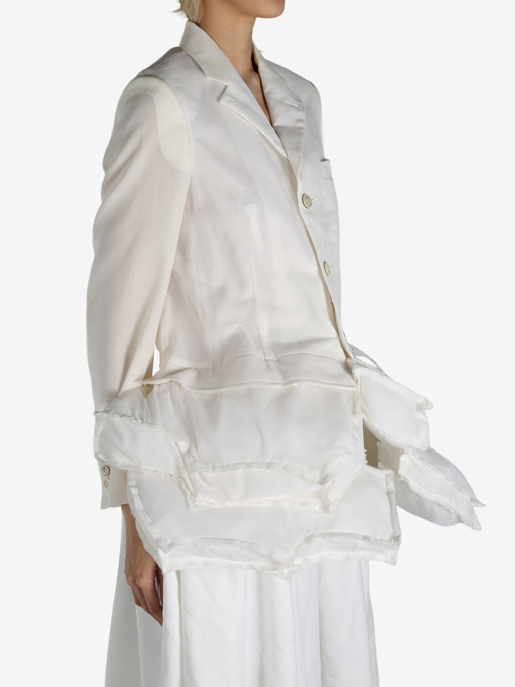 White jackets worn by a person, showing the jackets fit