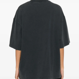 black t-shirts worn by a person, showing the t-shirts fit