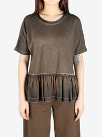 Brown top worn by a person, showing the top's fit