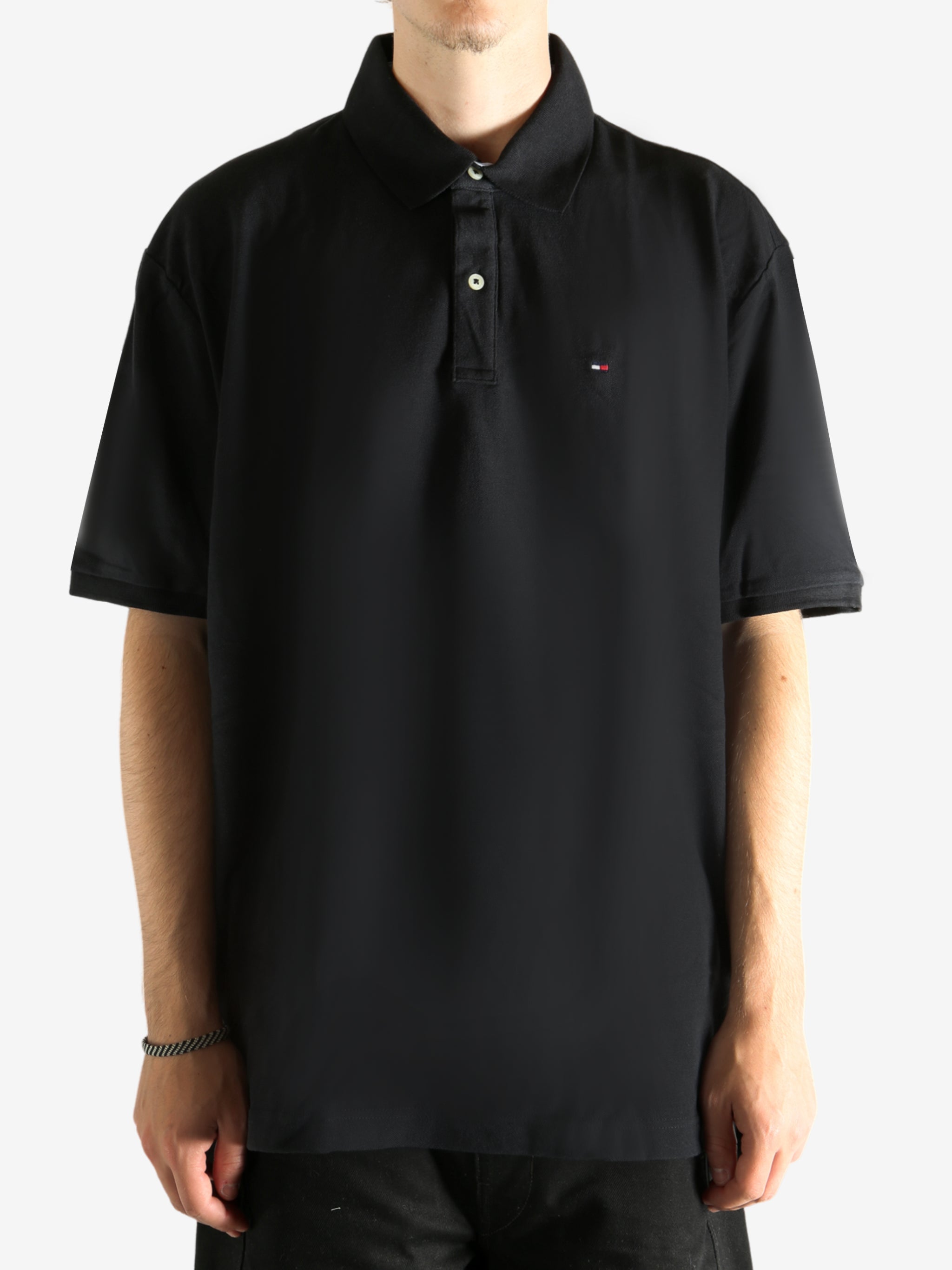 Black T-shirt worn by a person, showing the T-shirt's fit