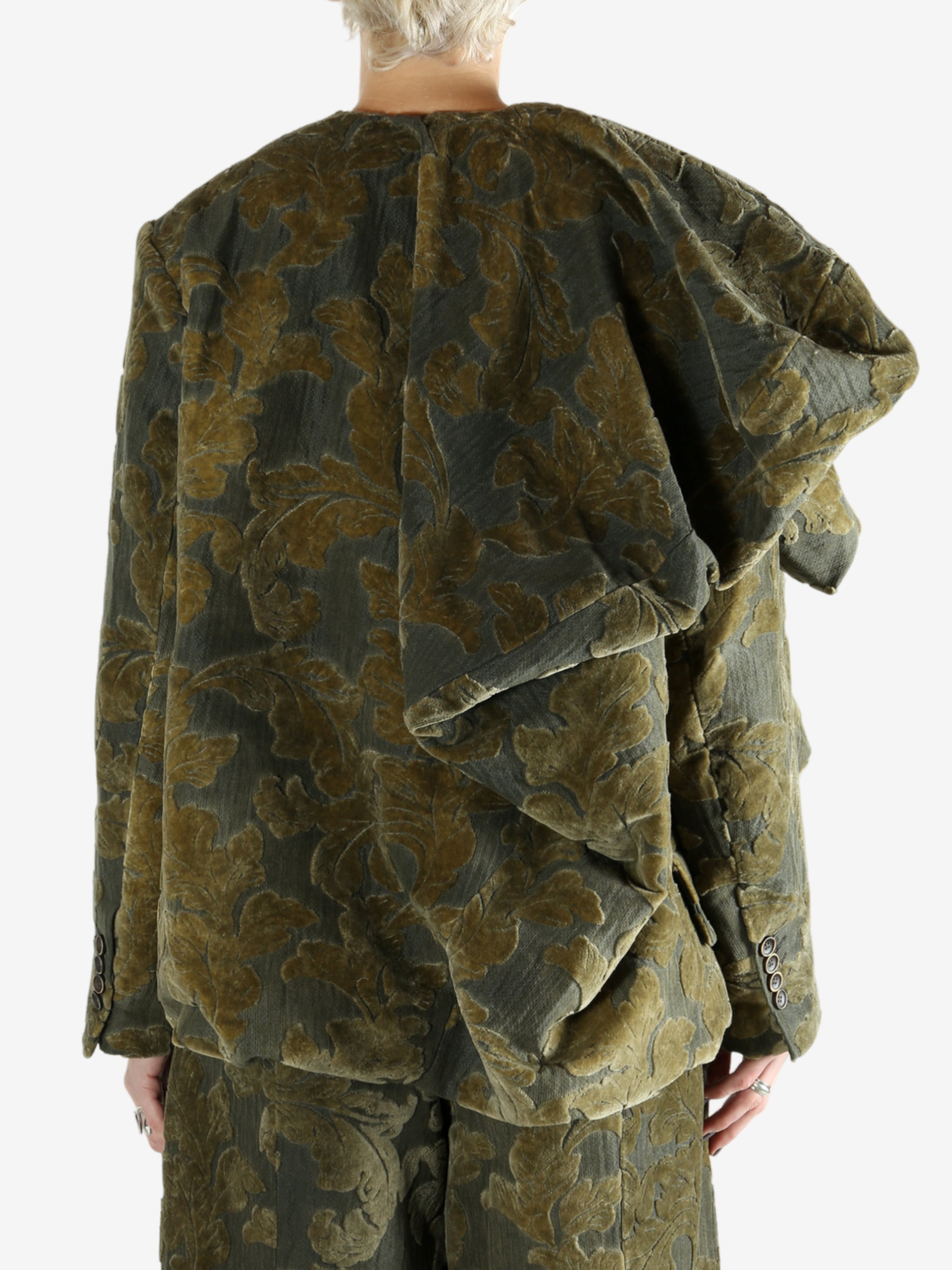 Grey jacket worn by a person, showing the jacket's fit