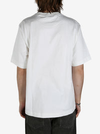 White shirt worn by a person, showing the shirt's fit