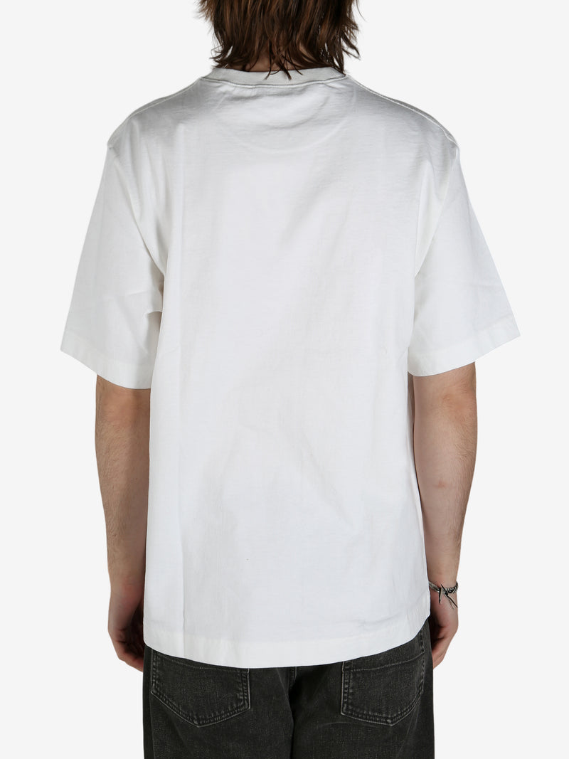 White shirt worn by a person, showing the shirt's fit