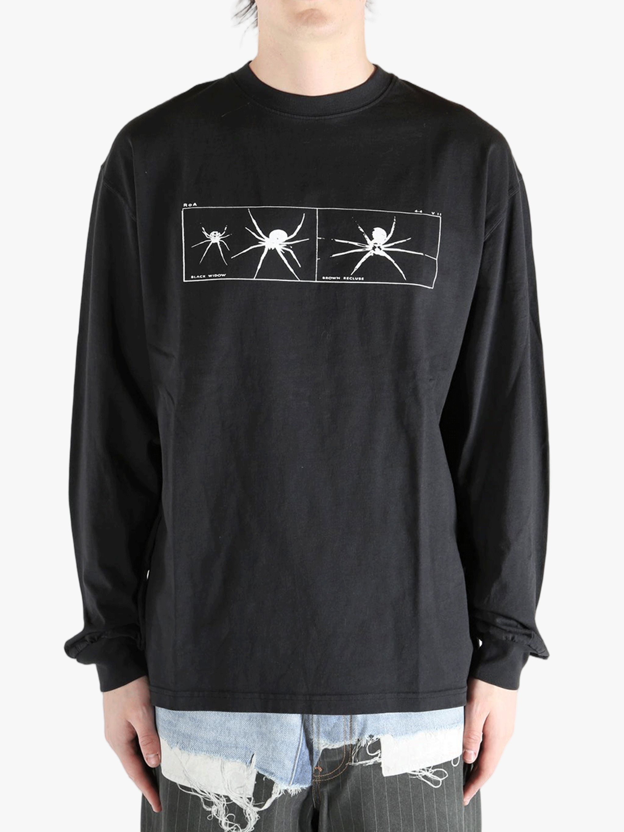 Black long-sleeve shirt worn by a person, showing the shirt's fit