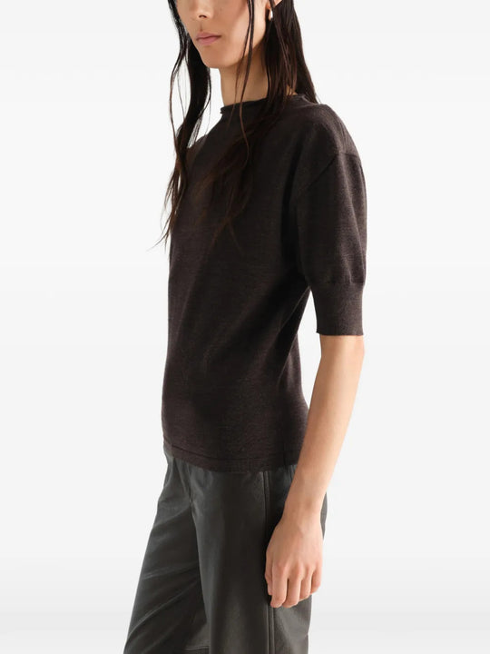 Brown knitwear worn by a person, showing the knitwear fit