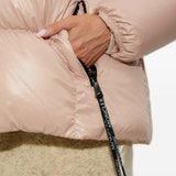 Pink jacket worn by a person, showing the jacket fit