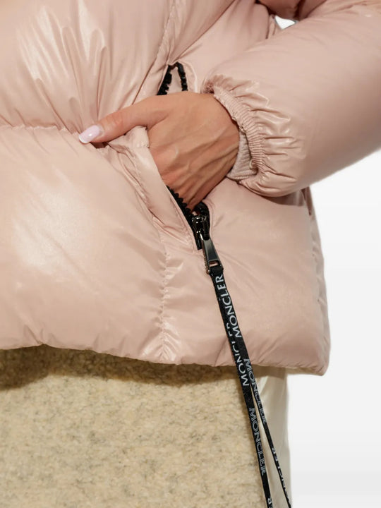 Pink jacket worn by a person, showing the jacket fit