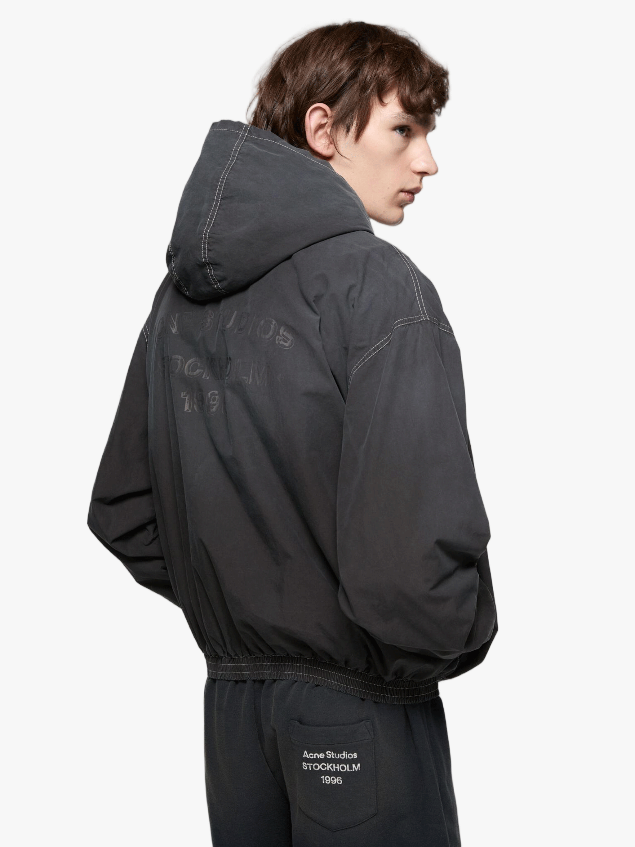 Black jacket worn by a person, showing the jacket fit