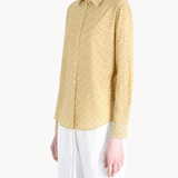Yellow shirt worn by a person, showing the shirt fit
