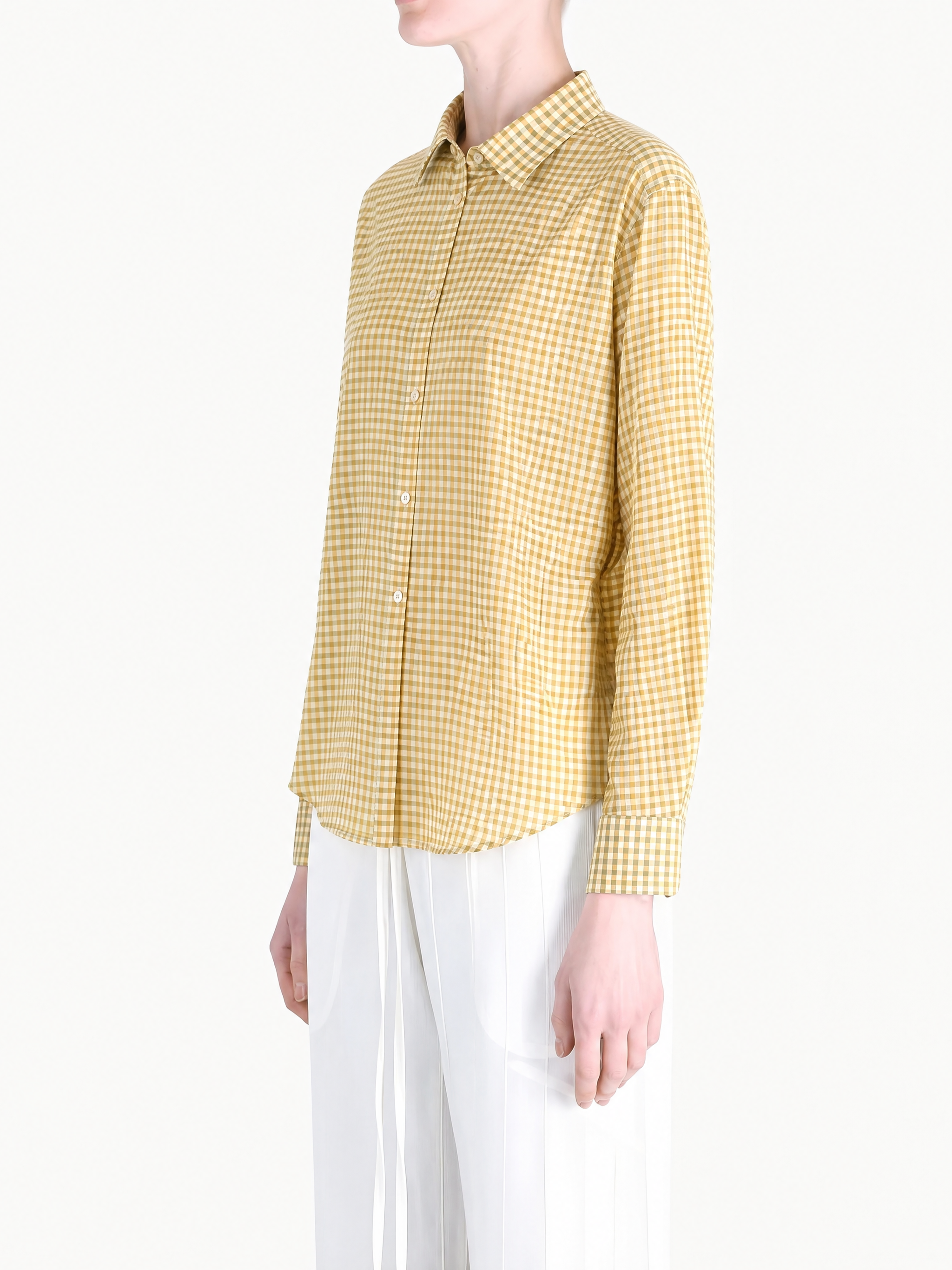 Yellow shirt worn by a person, showing the shirt fit