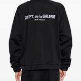 Black jacket worn by a person, showing the jacket fit