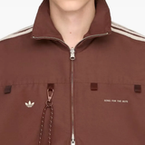 Close up of red jacket, showing texture of the recycled polyester fabric