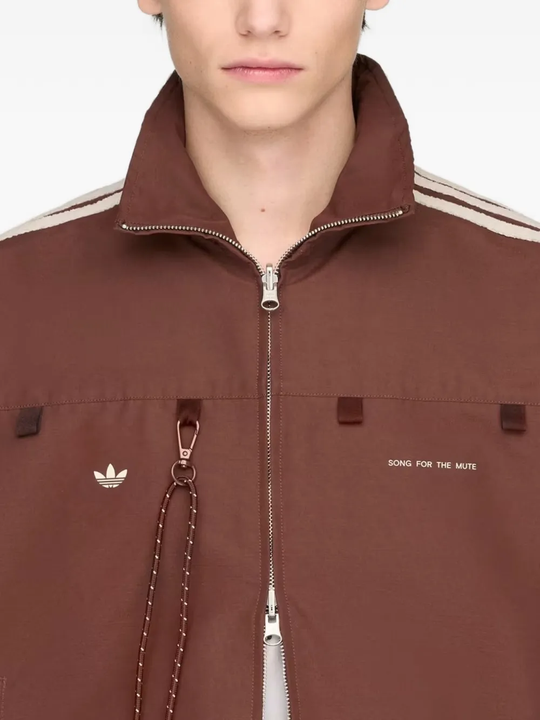 Close up of red jacket, showing texture of the recycled polyester fabric