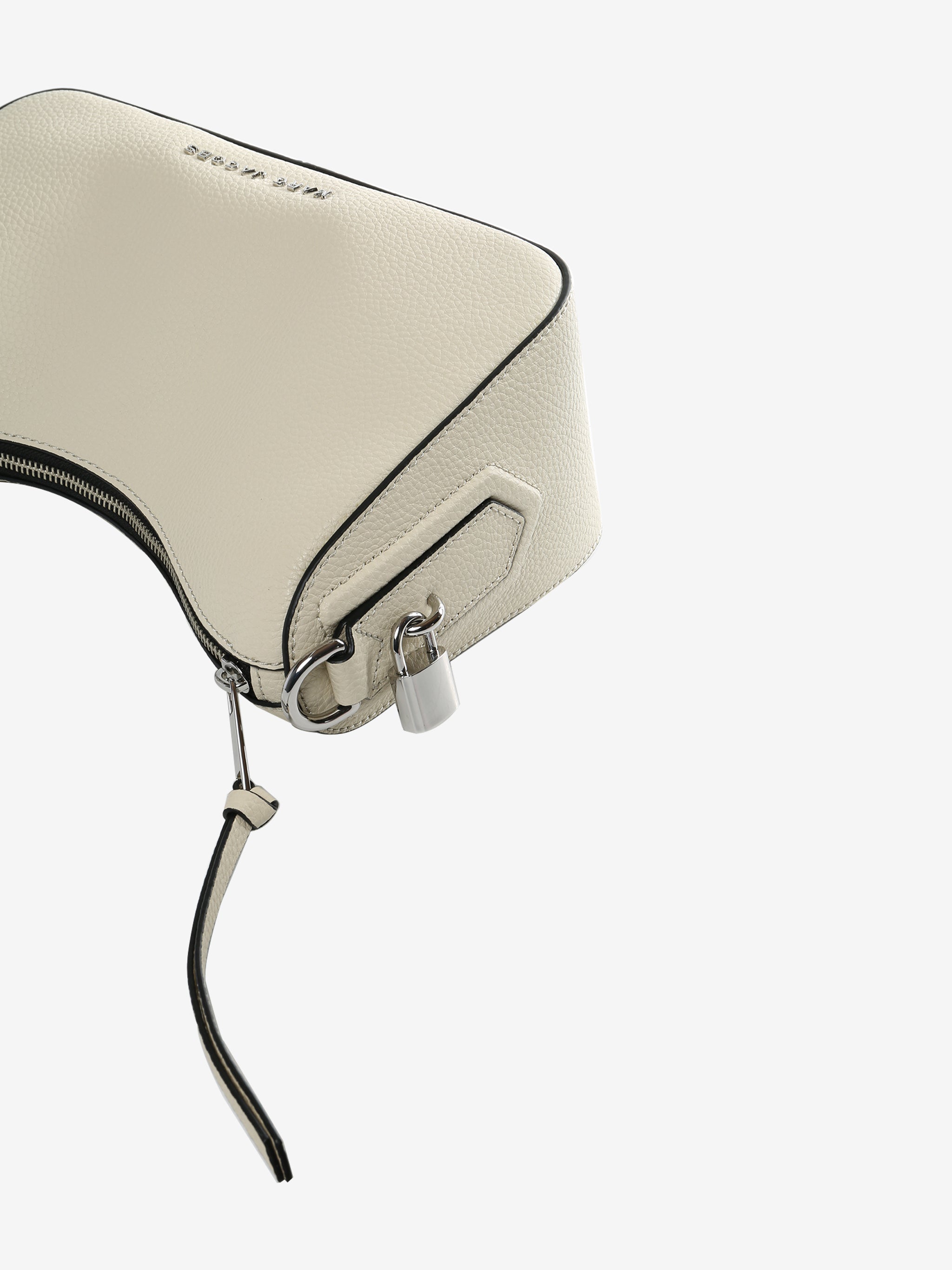 Close up of tan bag, showing texture of the split cow leather w fabric