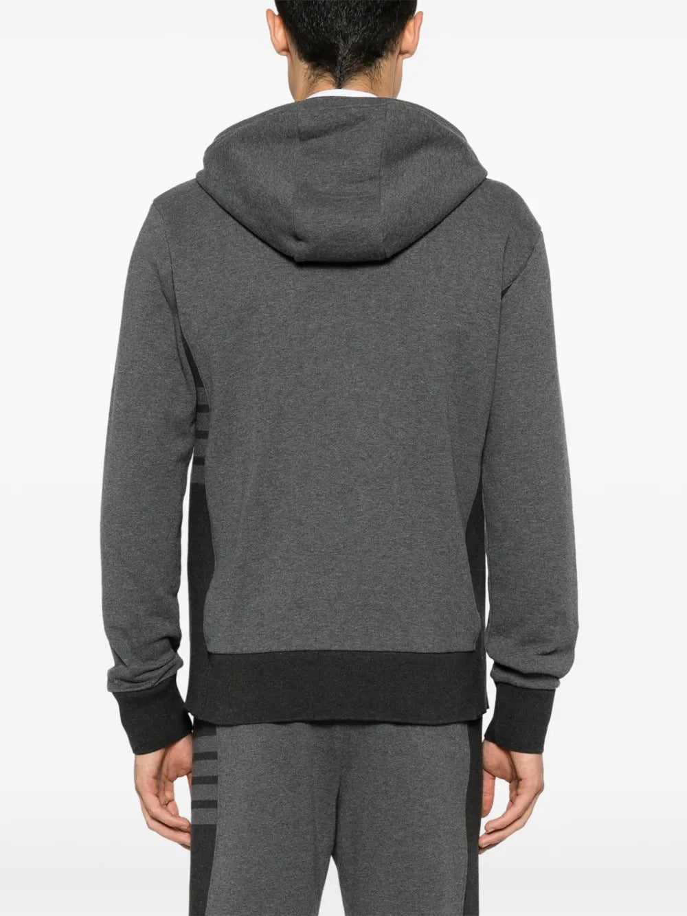 Grey hoodie worn by a person, showing the hoodie's fit