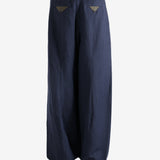 Navy pants worn by a person, showing the pants's fit