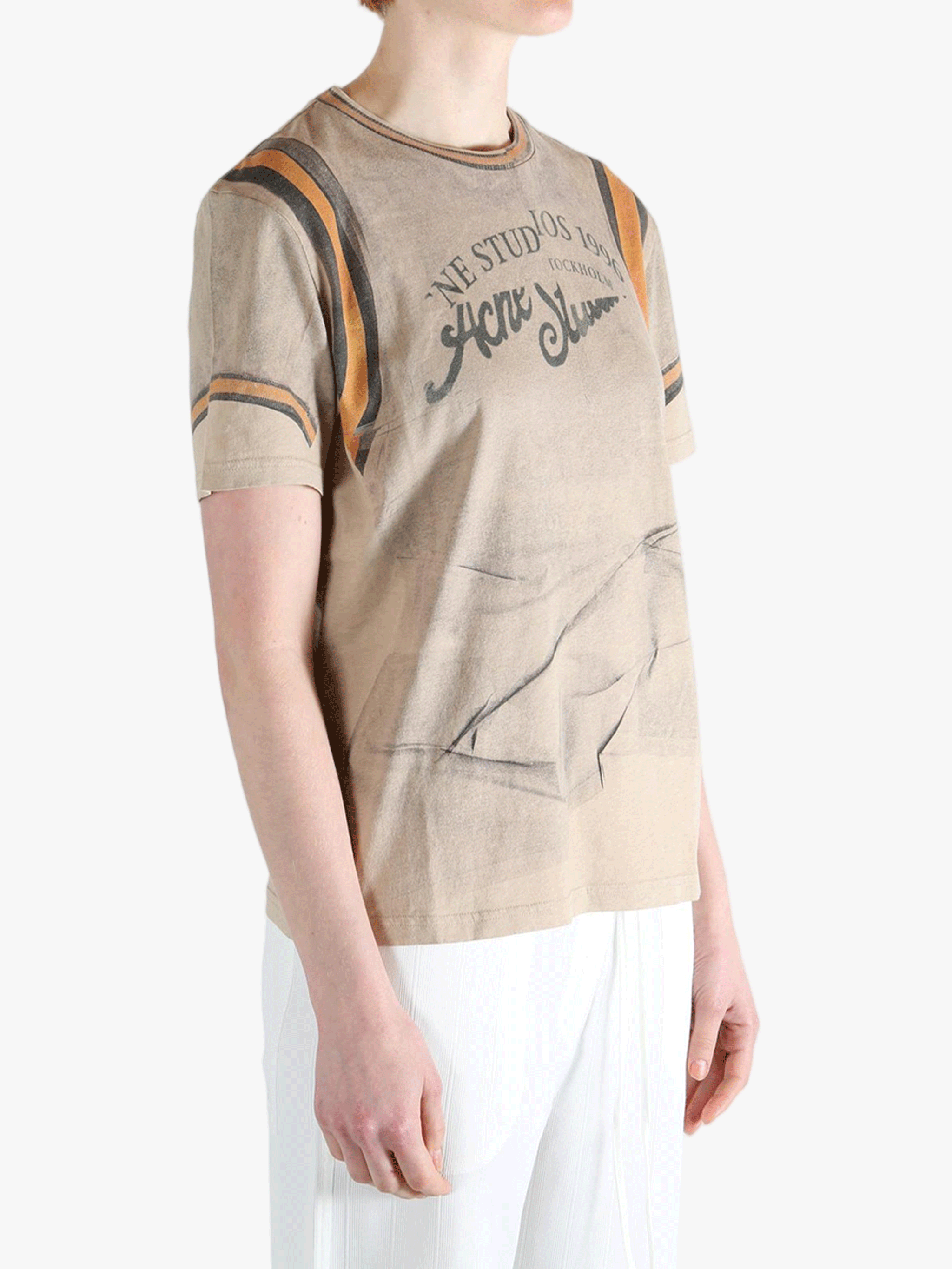 tan t-shirts worn by a person, showing the t-shirts fit