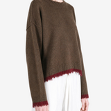 Brown top worn by a person, showing the top fit