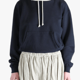 Navy parka worn by a person, showing the parka's fit