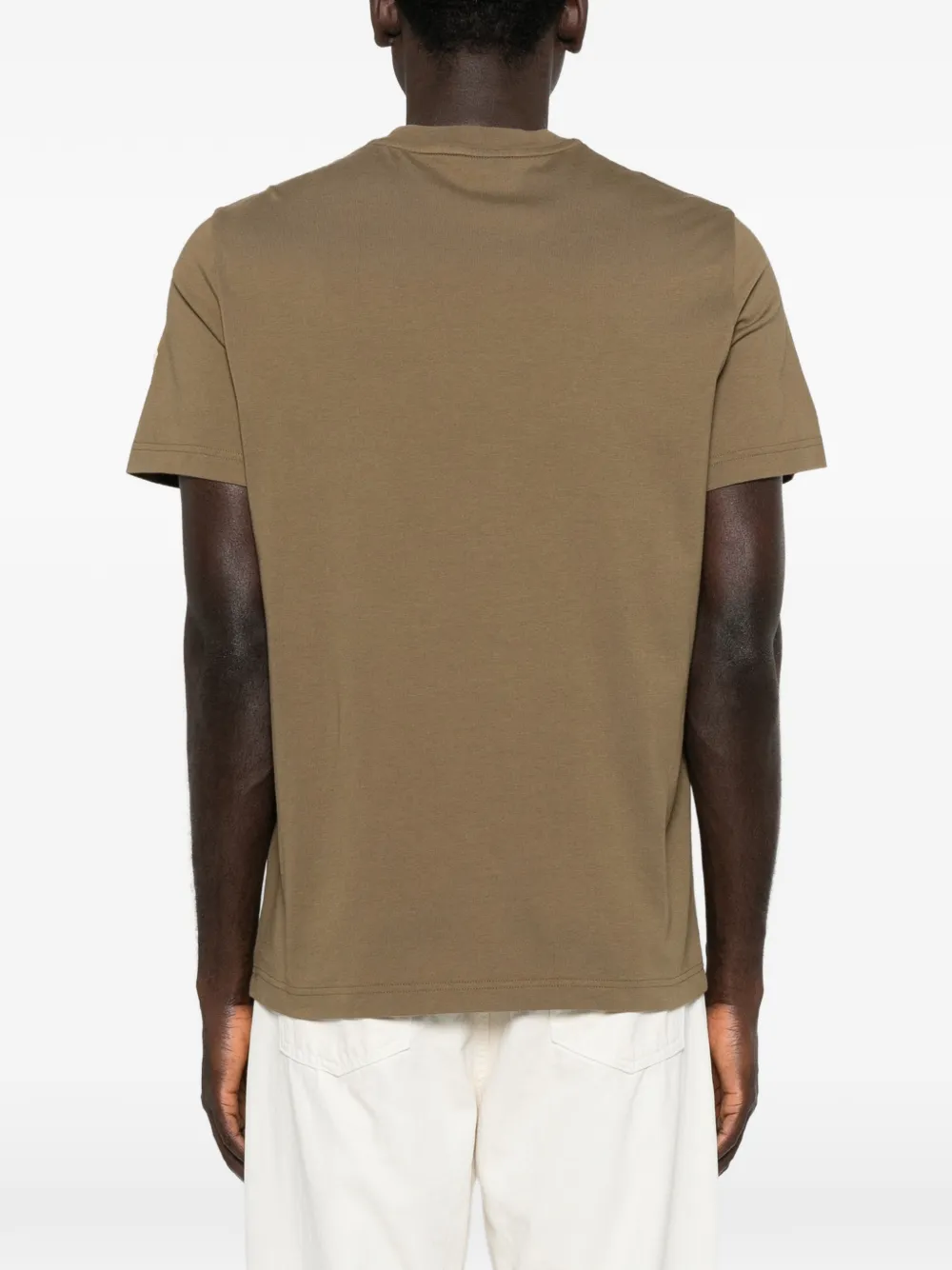 Yellow t-shirt worn by a person, showing the t-shirt fit