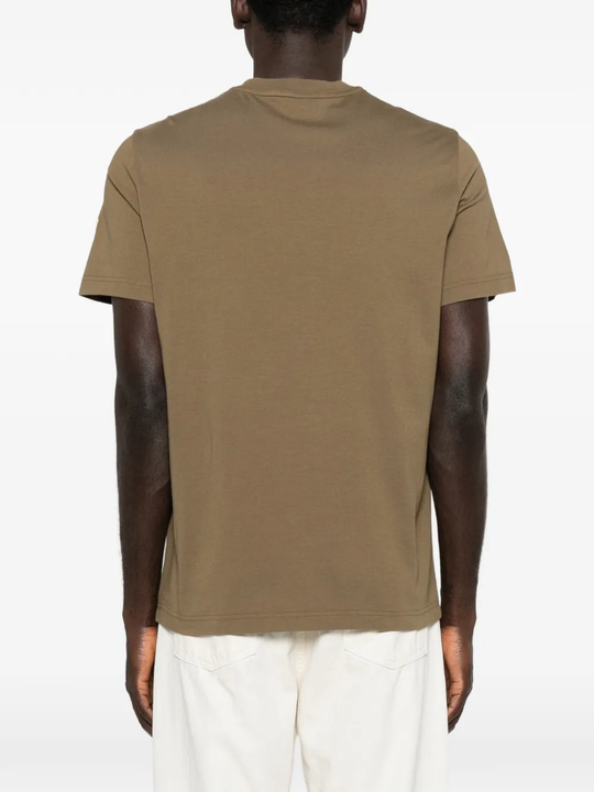 Yellow t-shirt worn by a person, showing the t-shirt fit