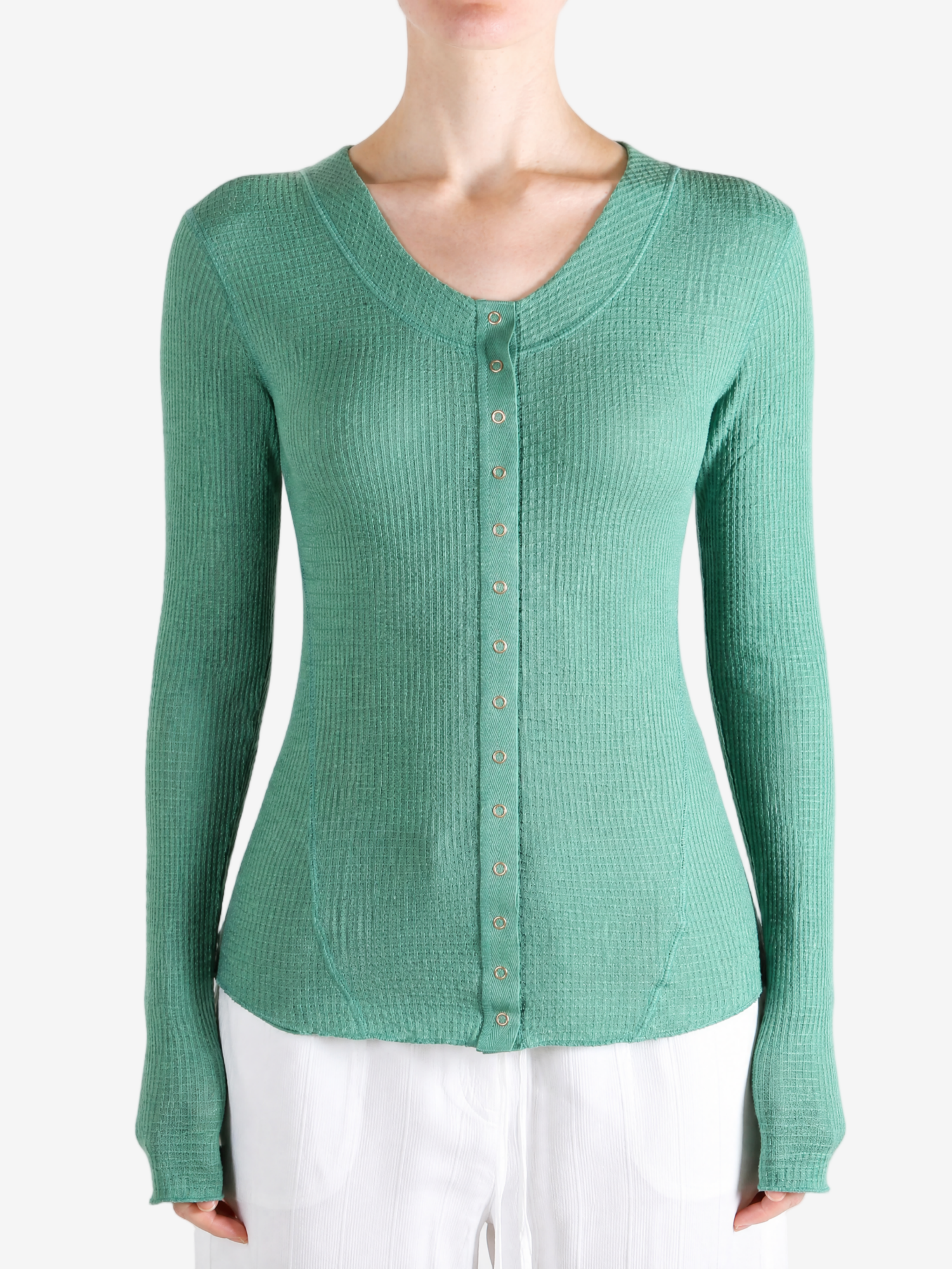 Green top worn by a person, showing the top fit