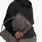 grey bag  worn by a person, showing the bag 's fit