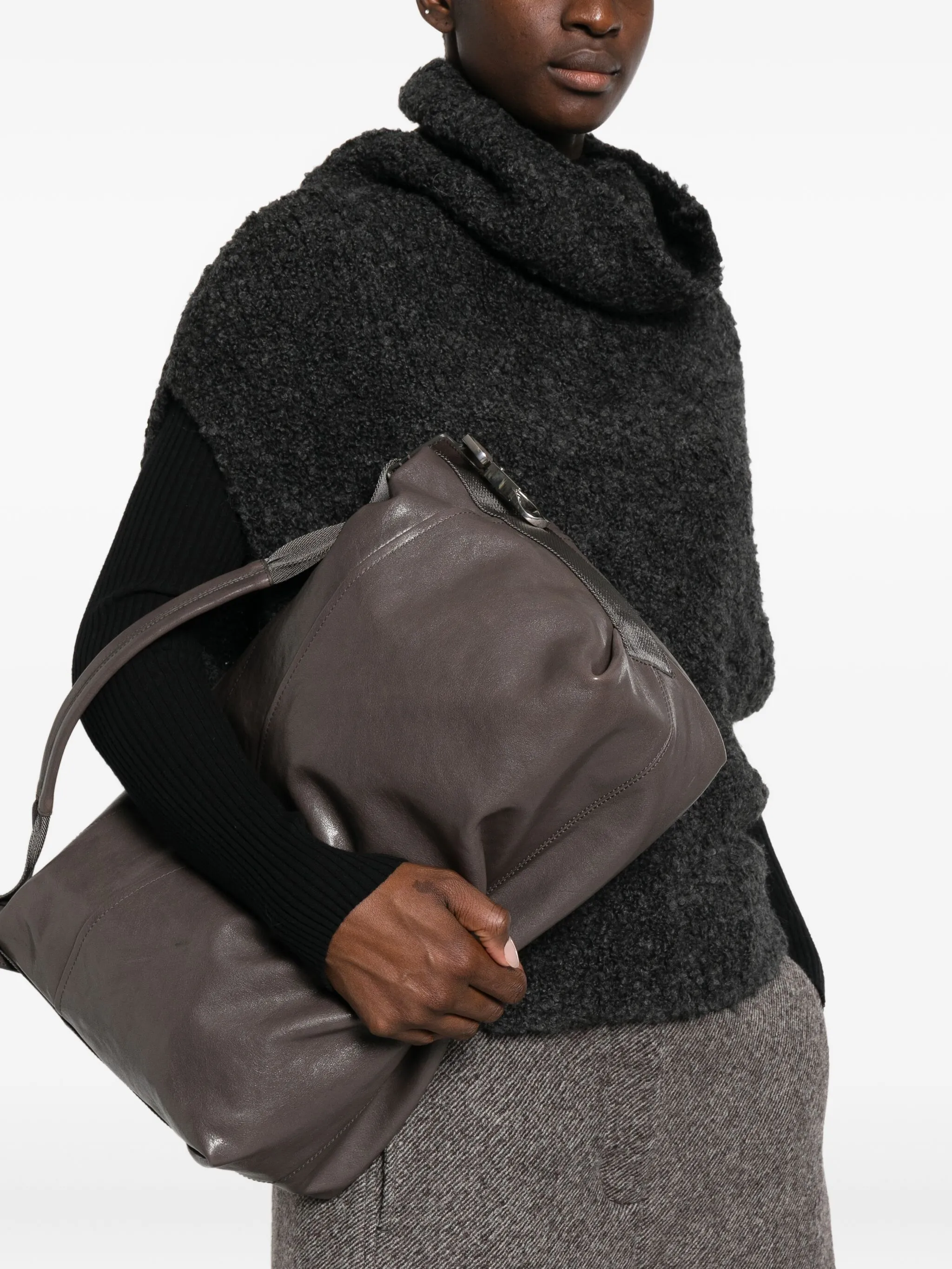 grey bag  worn by a person, showing the bag 's fit
