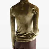 Green top worn by a person, showing the top fit